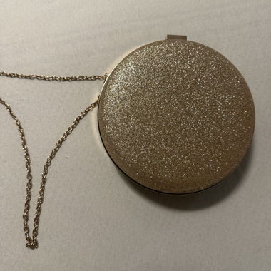 Clutch ronde dorée avec chaînette