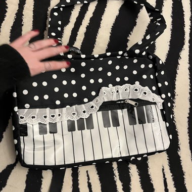 Black-and-white keyboard shoulder bag
