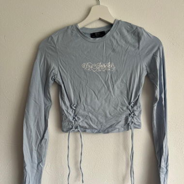 Maglia a maniche lunghe azzurro chiaro con lacci