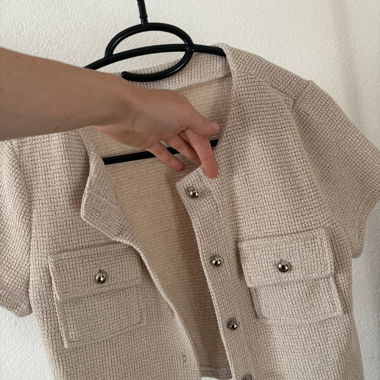 Gilet en maille beige à manches courtes