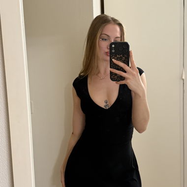 Black bodycon mini dress with deep V-neck