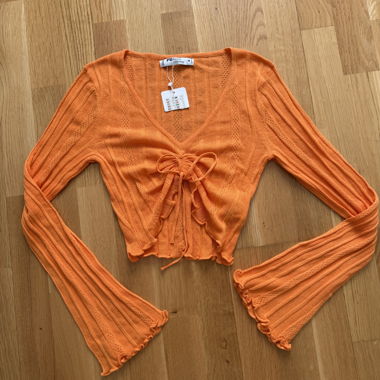 Haut en maille orange à laçage