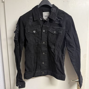 Distressed denim jacket