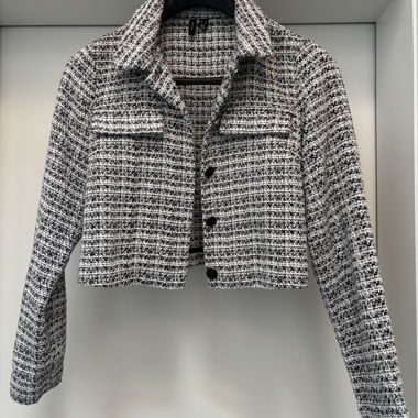 Veste courte en tweed noir et blanc