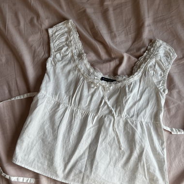 Top babydoll con bordo in pizzo