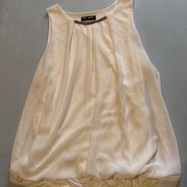 White sleeveless top with decorative stones