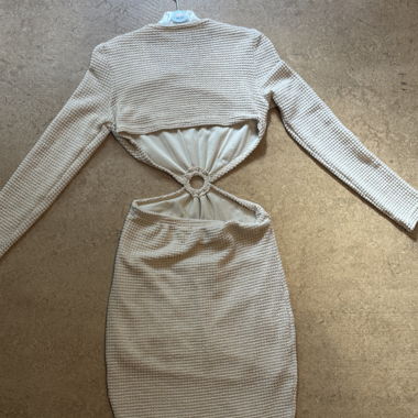 Beige knit dress with ring detail