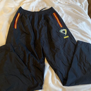 Pantaloni sportivi Puma neri con bande colorate
