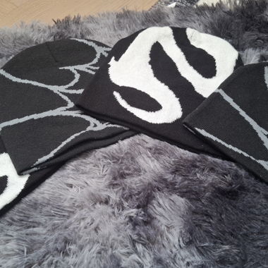 Set of 4 beanies with snake and web motifs
