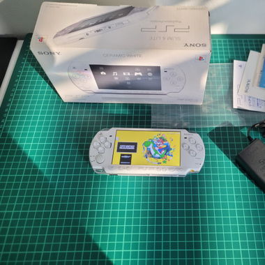 PSP in box with games installed 