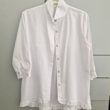 White ruffled blouse