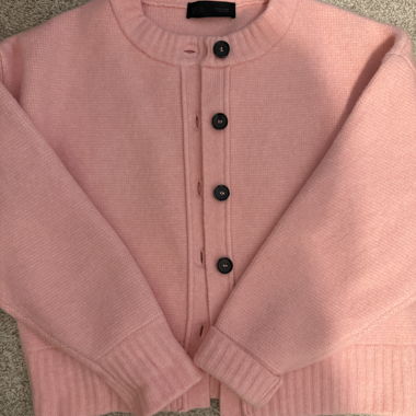 Pink knitted cardigan with button placket