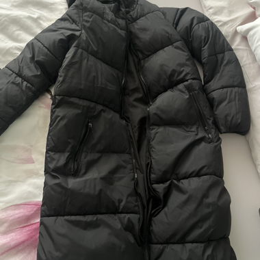 Long black quilted coat with hood