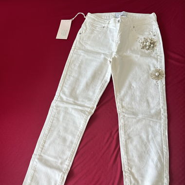 Edward Spiers white jeans with pearl flower detail