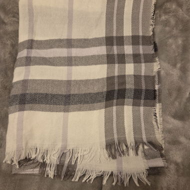 Warm autumn scarf in plaid pattern