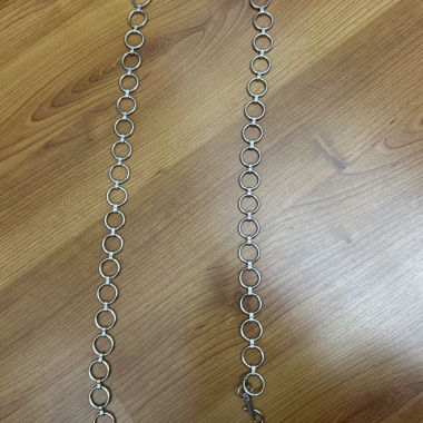 Silver-colored ring belt