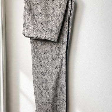 Flowing trousers with black and white floral print