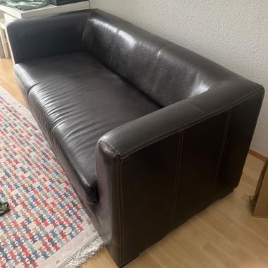 dark brown faux leather sofa
