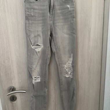 Jeans skinny grigi a vita alta