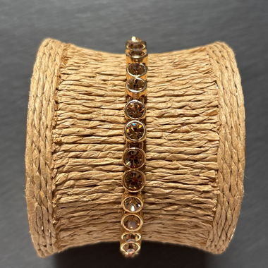 Golden bracelet with yellow-brown stones