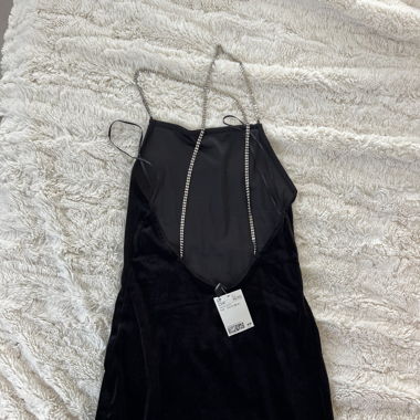 Brandnew black dress with silver chain detail