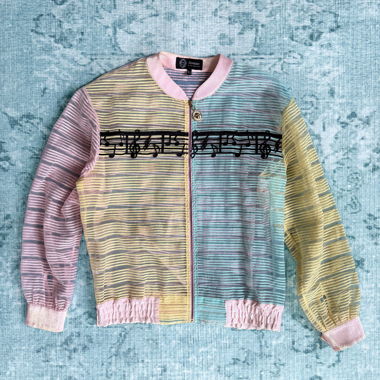 Giacca bomber trasparente con note musicali pastello