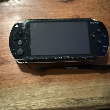 PSP with 4 games and case