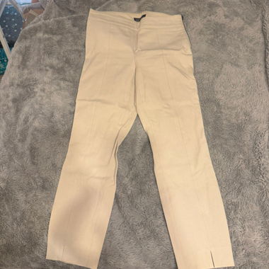 Pantaloni in tessuto beige con pince
