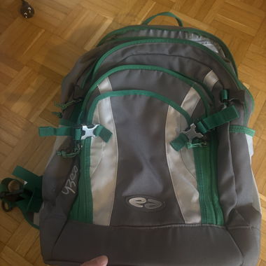 Grey and green trekking backpack