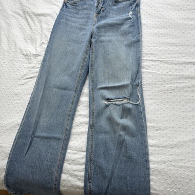 Jeans wide-leg strappati