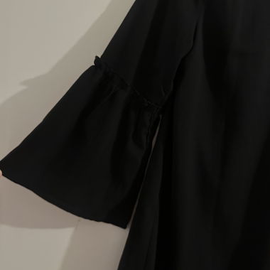 Elegant black dress with ruffle sleeves