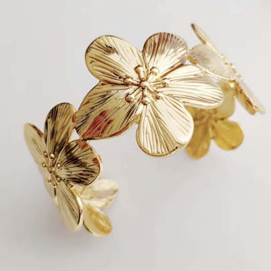 Bracciale rigido floreale color oro