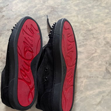 Sneaker Christian Louboutin con borchie