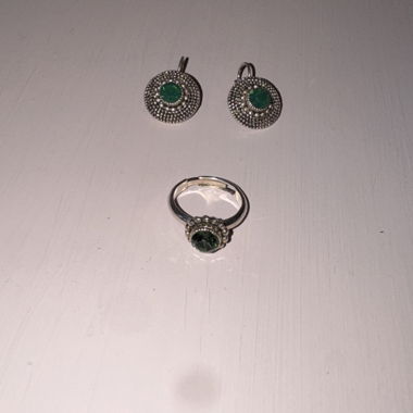 Silver-coloured jewellery set with green stones