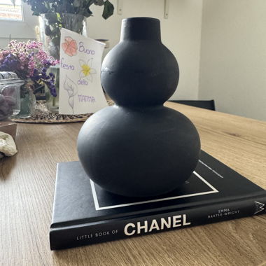 Chanel book and black vase