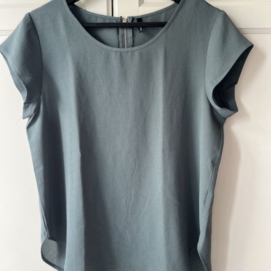 Blusa da donna color petrolio con zip