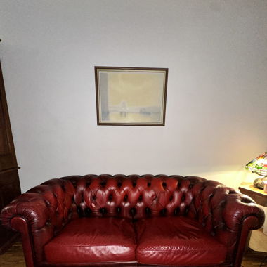 canapé style Chesterfield cuir rouge 