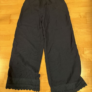 Black wide-leg pants with lace hem