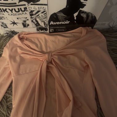 Top rosa a maniche lunghe
