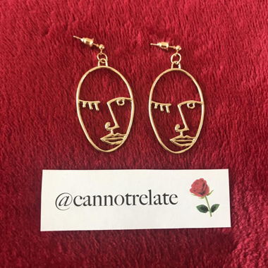 Boucles d'oreilles visage abstrait en contour
