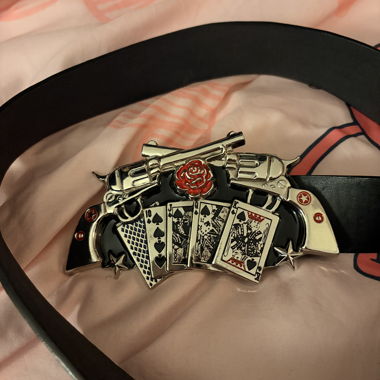 Black belt with playing cards and revolver buckle