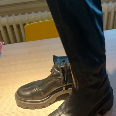 Black high, form-fitting boots