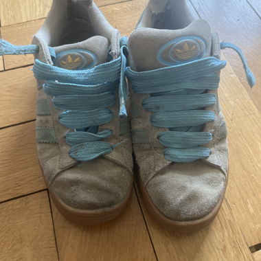 Adidas grey sneakers with blue laces