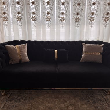 Stylish sofa with matching armchair
