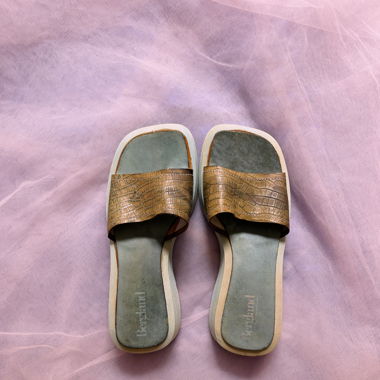 Sandals with animal print and pastel blue soles