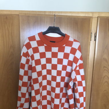 White/orange print pullover