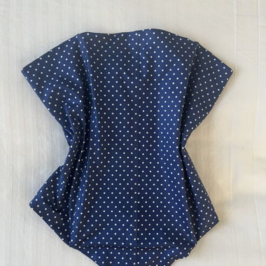 Top corsetto a pois che valorizza
