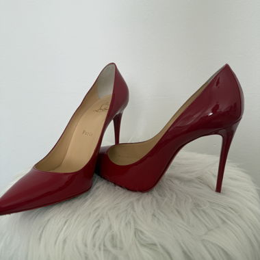 Red patent leather pumps by Christian Louboutin