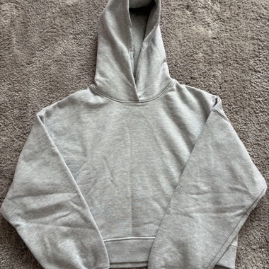 Grey hoodie with writing on the back