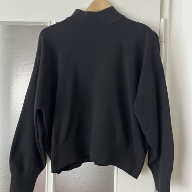 Black sweater with stand-up collar